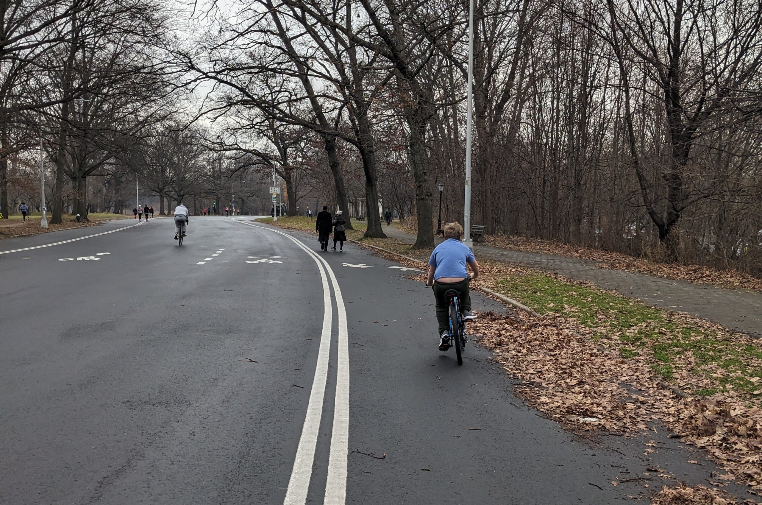 Group bikes rides with families through Brooklyn parks riding with Coach Rosa